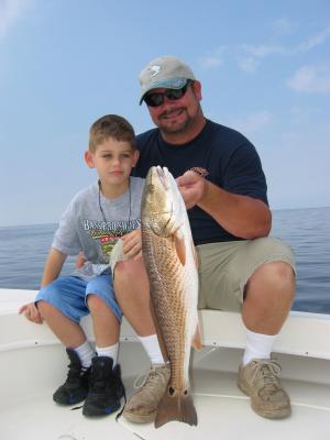 Mike and his son Justin with 25 inch Redfish